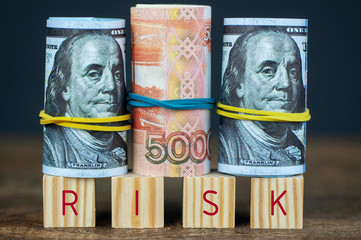 wooden blocks with the inscription risk and Russian money