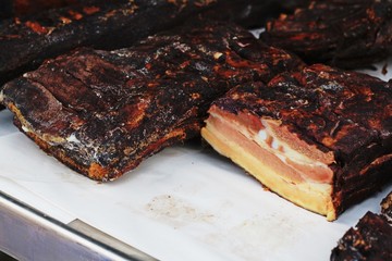 Briskets of grilled and smoked bacon