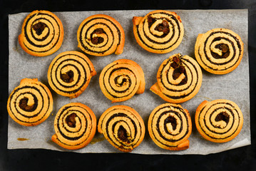 Baked cookies with raisins and poppy seeds on a trail.