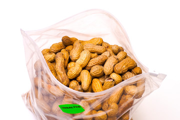 Peanuts in Plastic Bag Isolated on White