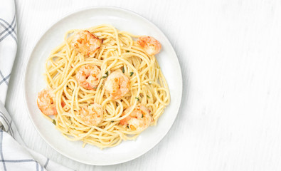 Pasta spaghetti with prawns on light background. Top view