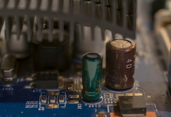 closeup macro on an computer motherboard and cpu with colorful mood, 