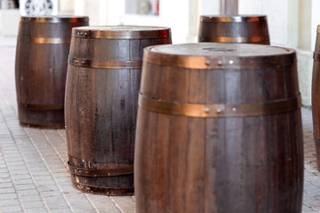 brown wooden barrel on outdoor on stone gray tile, bar decorations close up nobody.