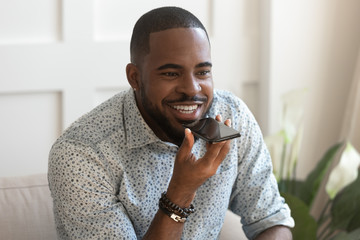 African guy speaks with girlfriend on speakerphone