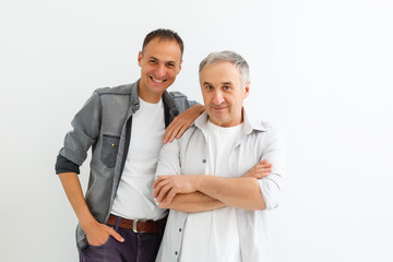 Senior Father With Adult Son on a white background