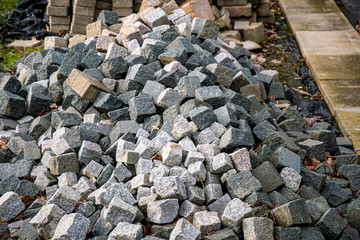 piles of cobblestones at the roadside for road construction