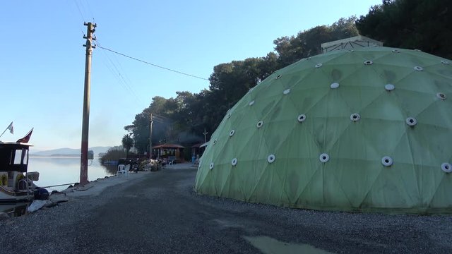 Koycegiz, Turkey - 18th of December 2019: 4K At the Sultaniye Termals - Panning spa facilities with a dome structure covering bath