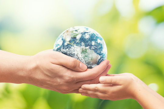 Earth globe in hands. World environment day. Elements of this image furnished by NASA.