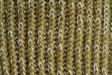 Knitted structure of green, gray threads. Vertical lines