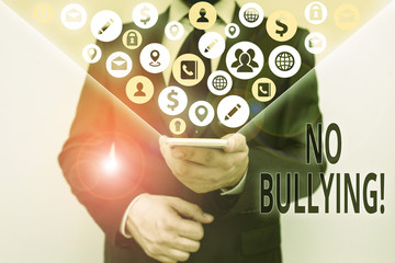Conceptual hand writing showing No Bullying. Concept meaning stop aggressive behavior among...