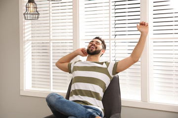 Young man relaxing at home. Peaceful rest