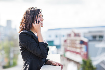 Happy African American businesswoman talking on the phone
