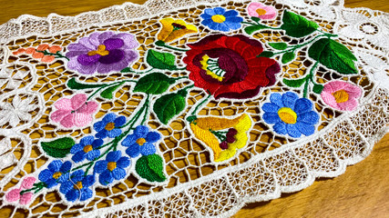 Unique embroidery hand made product on the table.