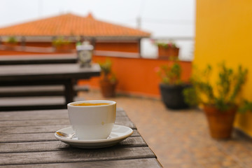 Cup of coffee on a wooden table