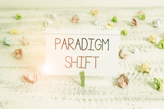 Writing note showing Paradigm Shift. Business concept for fundamental change in approach or underlying assumptions Green clothespin white wood background reminder office supply