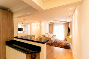 Modern interior of a living room with kitchen in a modern apatement