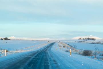 Fototapeta na wymiar Picturesque winter landscape of Iceland. The perfect road to perspective