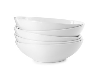Stack of clean bowls isolated on white