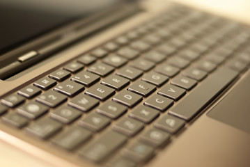 Blurred photo with shallow DOF of laptop keyboard
