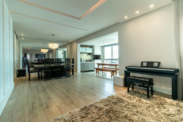 modern interior of a living room with table chairs sofa piano