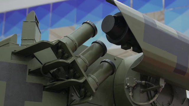 Armored car smoke guns grenades combat module weapon tank truck dark green camouflage camera movement closeup
