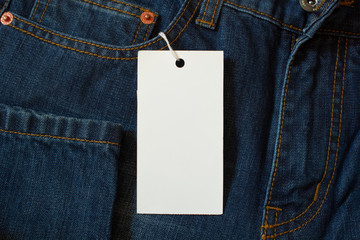 Element of jeans pants with white tag label.
