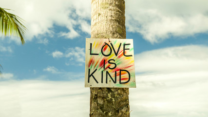 Love is kind sign on paradise Nacpan beach, El Nido, Palawan, Philippines