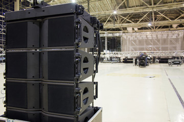 Flight cases with line array speakers. Installation of professional sound, light, video and stage...
