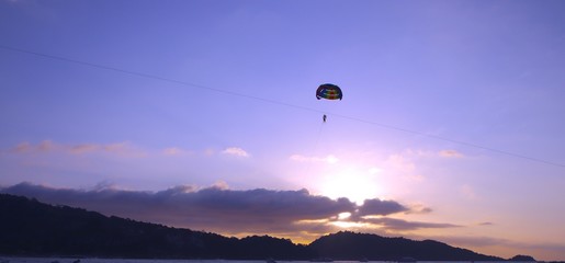 Parasailing at Patong Phuket Thailand at Sunset beautiful colours