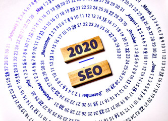 SEO 2020 text on wooden cubes on a monochrome background