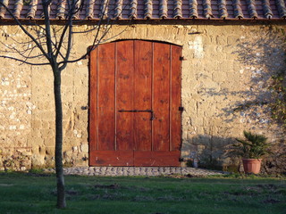 old door in brick wall