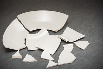 Broken Plate or broken water glass on the on the floor in the kitchen The concept of accidents in...
