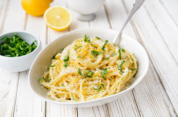 Pasta al Limone, delicious Italian meal, spaghetti with Parmesan, butter and lemon sauce, topped...
