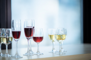 A glass of wine that is placed at a party