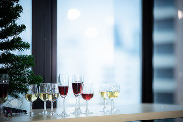 A glass of wine that is placed at a party