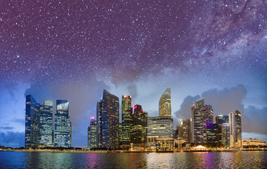 Naklejka premium Starry night over Singapore skyline
