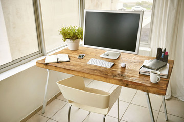Neat and modern work station with computer and tech ready