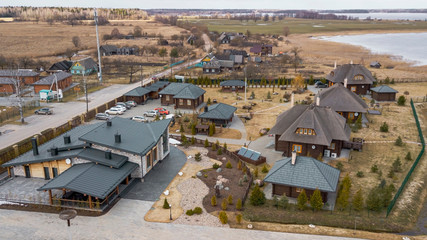 Obraz premium Aerial view of a tourist recreation center by the lake. Rest, tourism and vacation.