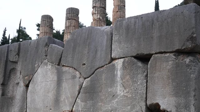 Ruins of the ancient temple of Apollo, archaeological site of Delphi along the slope of Mount Parnassus, UNESCO World Heritage, Greece.