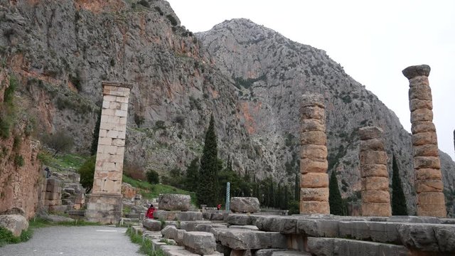 Ruins of the ancient temple of Apollo, archaeological site of Delphi along the slope of Mount Parnassus, UNESCO World Heritage, Greece.