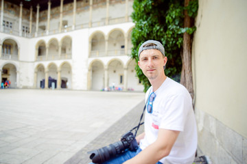 Man during sightseeing old castle in Cracow, Wawel.