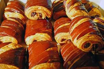 Freshly baked chocolate croissants in a French bakery