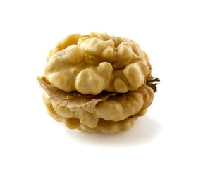 Whole walnut kernel isolated on white background. Walnut without shell, clean.
