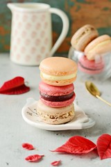 French Colorful Macarons Colorful Pastel Macarons. Small French cakes. Valentine's day concept. Romantic morning, gift for beloved. Breakfast on Valentin's, Mothers, Women's day. Sweetness for two.