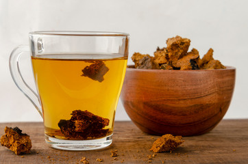 Chaga mushroom tea. medicinal drink with pieces of chaga