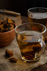 Chaga mushroom tea. medicinal drink with pieces of chaga