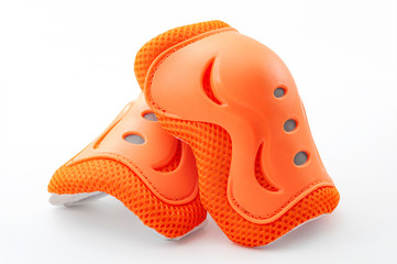 Cycling safety equipment, extreme sports and bicycle riding gear conceptual idea with orange knee...