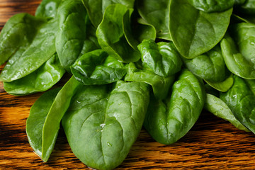  Green juicy fresh spinach leaves, vitamins and wholesome food, vegetarianism and proper nutrition theme, place for text.