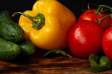 resh juicy vegetables, tomatoes and peppers, spinach leaves and cucumbers, salad, vegetarianism and healthy eating
