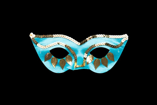light blue carnival mask with golden beads and leaves
